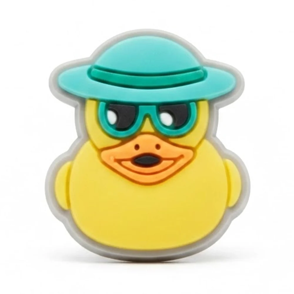 Jibbitz canard jaune avec chapeau turquoise et lunettes de soleil, version fluo