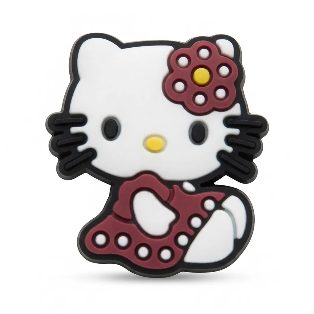 Jibbitz Hello Kitty assise, robe bordeaux à pois blancs et fleur bordeaux à cœur jaune