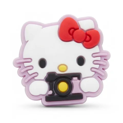 Jibbitz tête de Hello Kitty tenant un appareil photo noir, contour lilas et nœud rouge