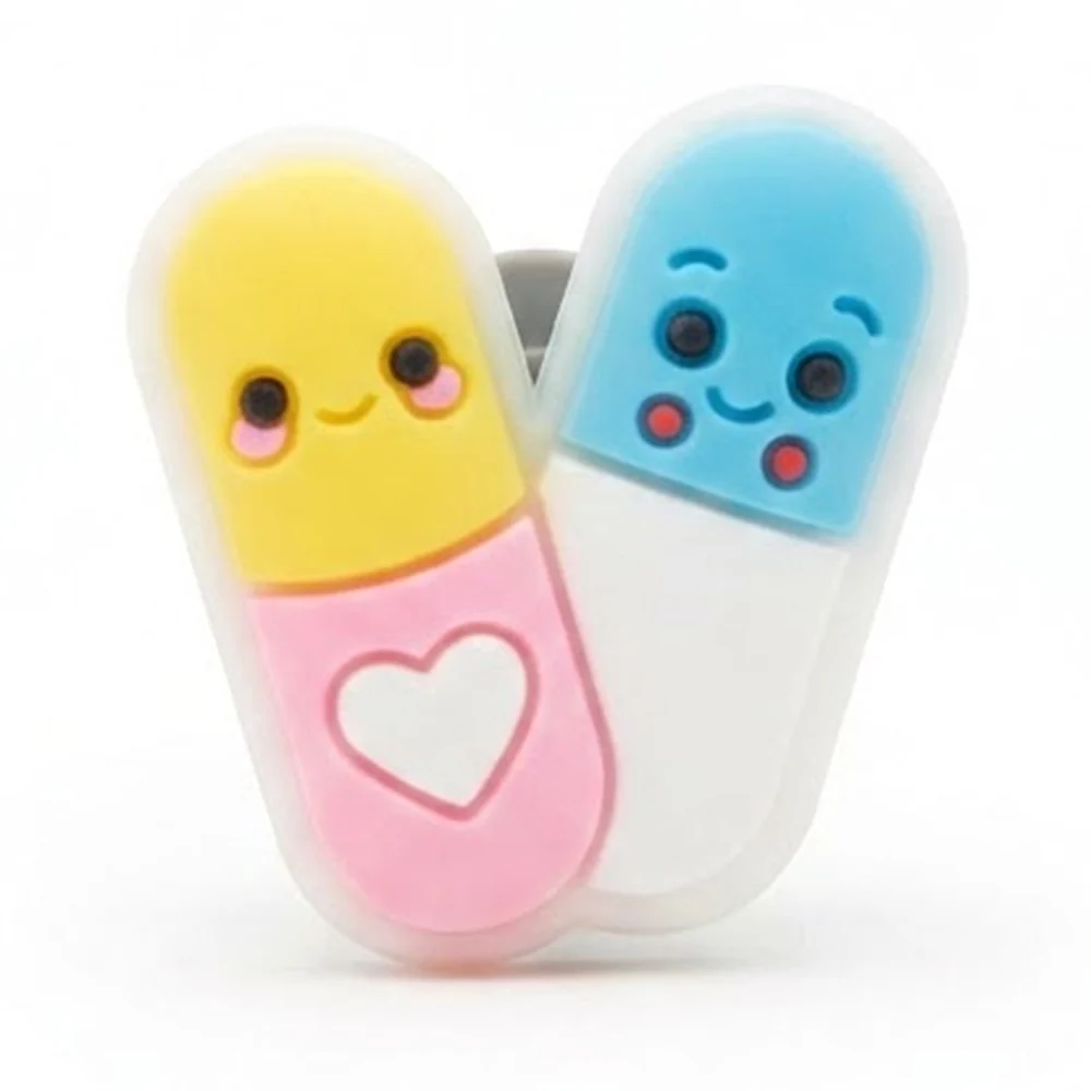 Jibbitz duo de gélules kawaii version fluo, tons pastel jaune, rose et bleu