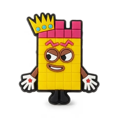 Jibbitz Numberblocks jaune avec couronne dorée, gants blancs et sourire malin