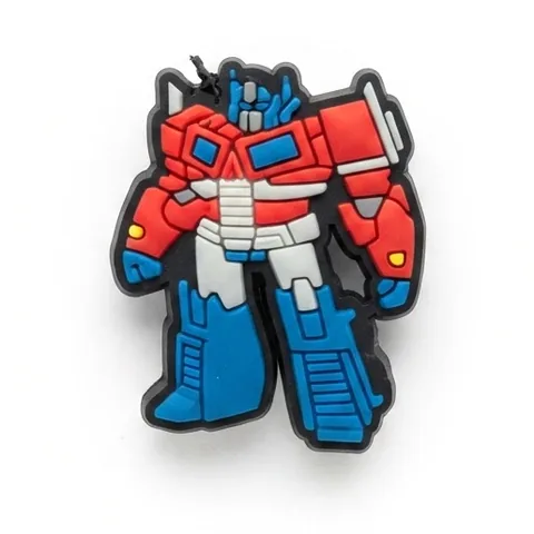 Jibbitz Optimus Prime robot debout en rouge, blanc et bleu clair, style dessin animé